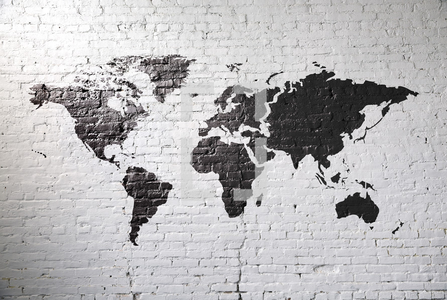 world map on a white brick wall.