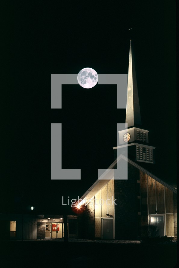 full moon over a church 