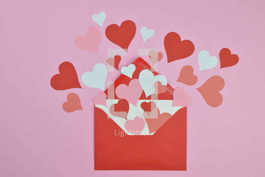 red and pink hearts in a red envelope 
