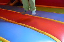 children bouncing on a bounce house