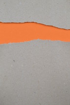 blank space between torn paper - ripped paper revealing bright orange blank space for words