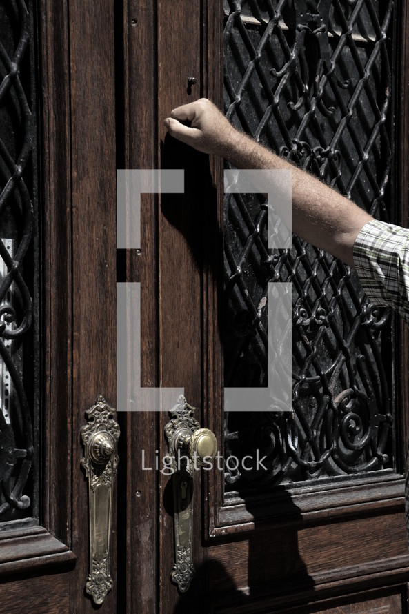 someone knocking at an old door.