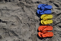 flip flops in the sand on the beach