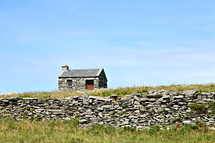 stone cabin and stacked stone fence