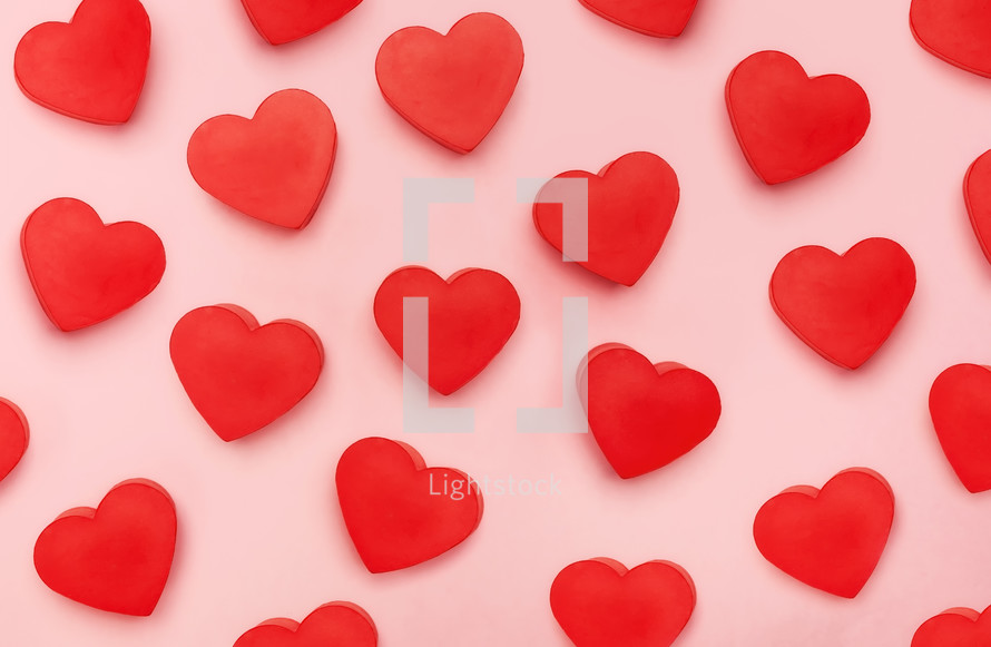 red hearts on pink background 