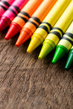 crayons on a wood background 