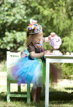 little girl having a princess tea party