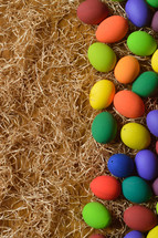 dyed Easter eggs on straw 