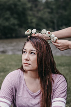 a woman with flowers in her hair 