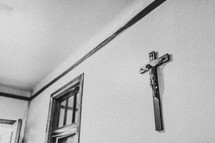 Wooden crucifix hanging on an office wall.
