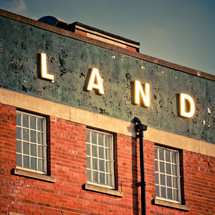 LAND sign on a building 
