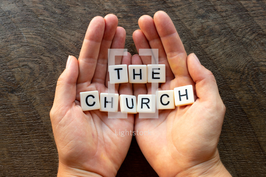 cupped hands with the words the church 
