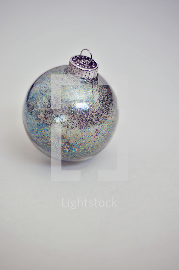 A silver Christmas ornament. 