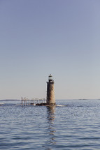 lighthouse in water 