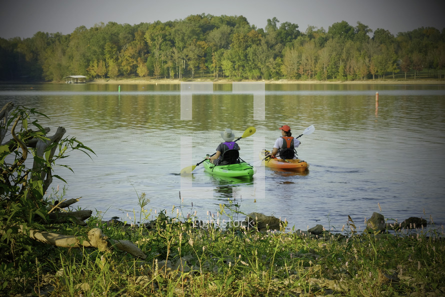 paddling kayaks in a lake 