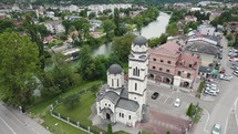 Banja Luka aerial: Orthodox Srpska pravoslavna crkva church beside river in Bosnian Town