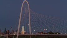 Time lapse of the moon rising over Margaret Hunt Hill Bridge in downtown Dallas, Texas.