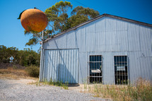 metal shed and peach logo