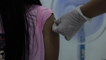Asian Girl Receiving Covid Vaccine
