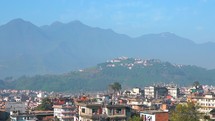 Clear skies bluebird showing himalayas mountain range landscape downtown Kathmandu Nepal 