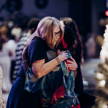 women hugging at church 