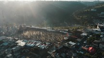 Aerial Drone shot of Afternoon Of All Saint"s Day People Gathered During The Sumpango Kite Festival In Guatemala. 