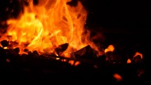 Turning Burning Coals in a Blacksmith Forge