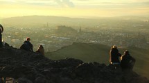 at the top of Kings seat in Edinburgh Scotland at sunset 