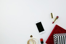 lipstick, earrings, bracelets, nail polish, makeup, presents, iPhone, phone, white background 