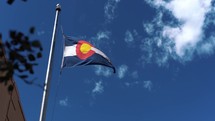 Colorado Flag Waving in the Wind with Sky in Background