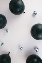 black balloons and mirror disco ball ornaments 