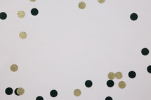 black and gold confetti frame on white background 