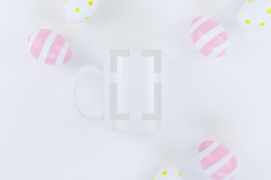 white coffee mug and Easter eggs 