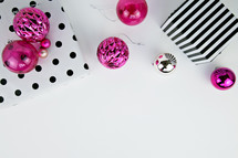 pink ornaments and black and white wrapping paper 