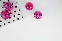 pink ornaments and black and white polka dot wrapping aper 