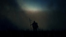 A Warrior Standing Alone in a Field Under Storm