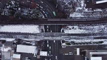 Railroad and cars under the bridge in winter