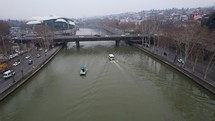 Boat in the river under the bridge