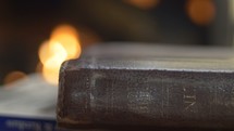 Bible by a hearth 