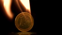 Euro coins on fire. Filmed is slow motion 1000 fps. 