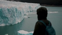 Closeup Of Hiker Looking At Perito Moreno Glacier In Los Glaciares National Park, Argentina. selective focus