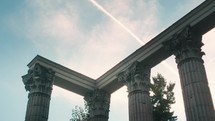 Old ruins of temple on sunny day clouds above