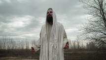 Actor dressed as Jesus Christ preaching to and teaching his disciples and followers. Or Bible prophet like Moses, Elijah, John The Baptist or Noah or Christian apostle Paul or Peter, preaching, teaching and prophesying in the wilderness.