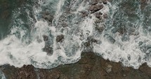 Top View Of Foamy Waves Hit On Rocky Outcrops On The Shore In Guanacaste Beach, Costa Rica. Aerial Shot
