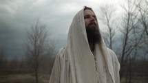 Religious, Christian man with beard or Jesus Christ, bible prophet looks to heaven in prayer and worship.