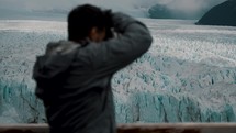 Photographer Taking Photos Of The Vast Icebergs Of Perito Moreno Glacier In Argentina, Patagonia. Selective Focus Shot