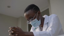 praying female doctor 