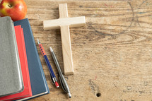 red, navy, gray books, apple and pens and cross