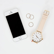 iPhone, watch, and gold rings 