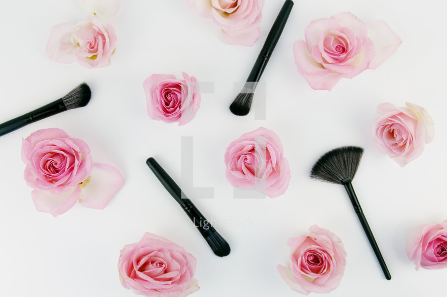 makeup brushes and pink roses 